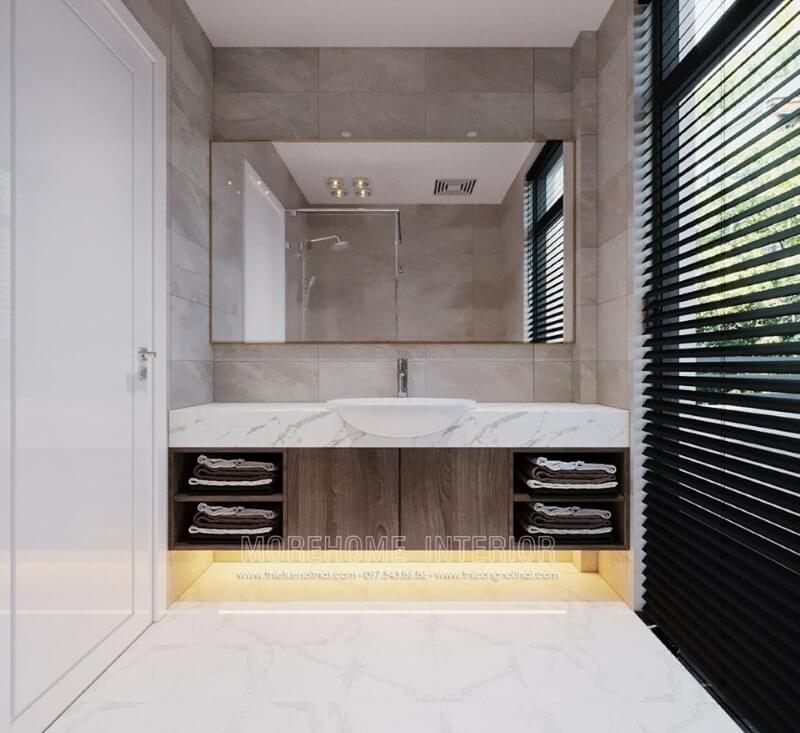 Mẫu đá nhân tạo cao cấp có màu trắng vân mây được sử dụng để ốp mặt lavabo trong nhà tắm biệt thự của các căn hộ thành phố.